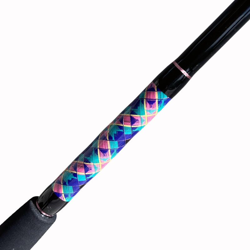 Load image into Gallery viewer, Built like our Fin #18, this spinning rod comes with Fuji alconite guides, EVA foam grips, Fuji reel seat, and metal gimble. Butt wrap side view, diamond pattern, Blue, teal, pink and yellow. Metallic Pink trims. partial foam grip showing. 
