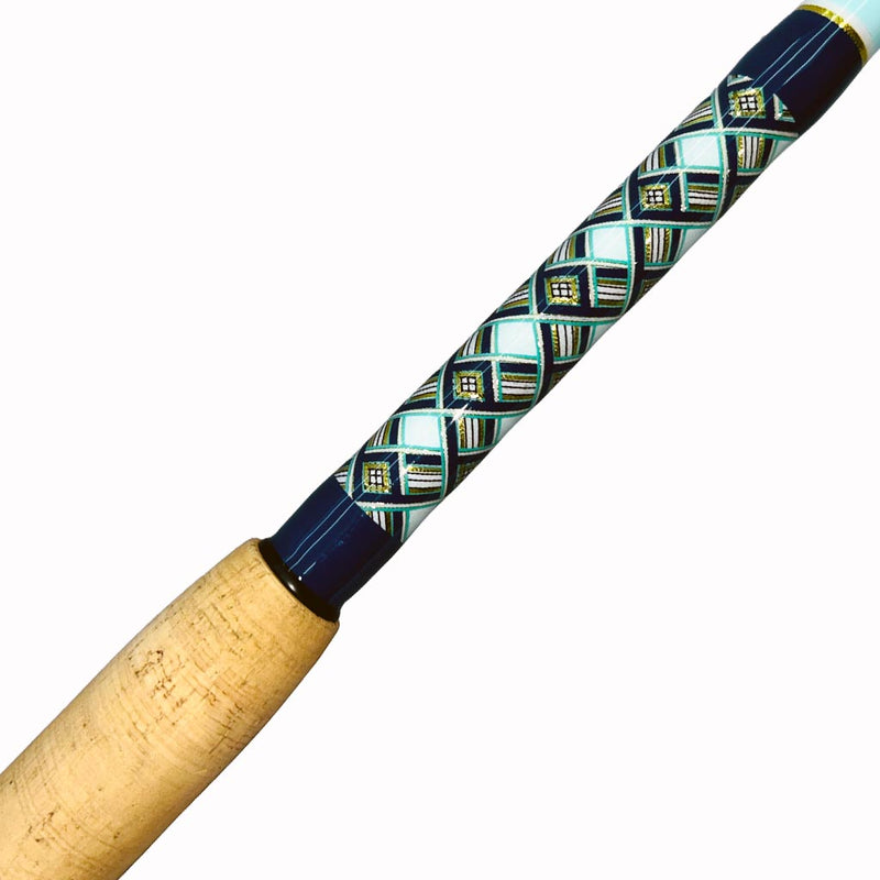 Load image into Gallery viewer, Built just like our Fin 139, this beautiful rod comes equipped with Big Game Cork, Black Winthrop Epic Butt, Fuji heavy duty guides and top. Navy blue, teal, white and gold diamond pattern butt wrap. Partial cork grip showing.

