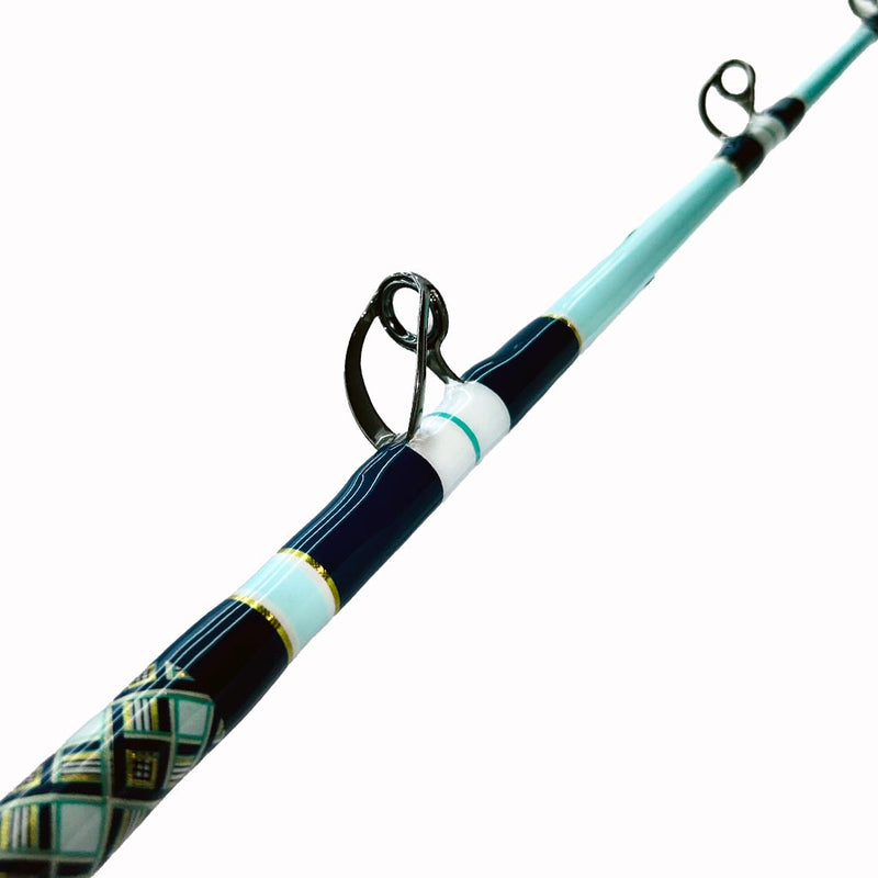 Load image into Gallery viewer, Built just like our Fin 139, this beautiful rod comes equipped with Big Game Cork, Black Winthrop Epic Butt, Fuji heavy duty guides and top. Teal, navy blue, white and gold diamond pattern wrap showing. Two eyes showing. 
