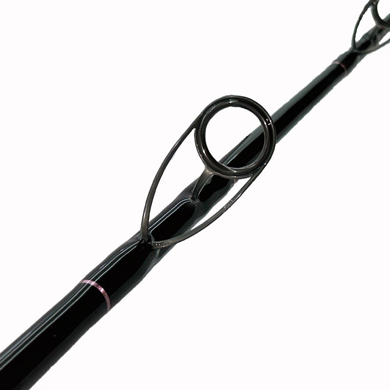 Load image into Gallery viewer, #76 Limited Edition &quot;Seas the Moment&quot; 7&#39; 30lb Spinning Rod. Bottom eyelet is shown with partial second bottom eyelet. Guide trims are metallic pink. 
