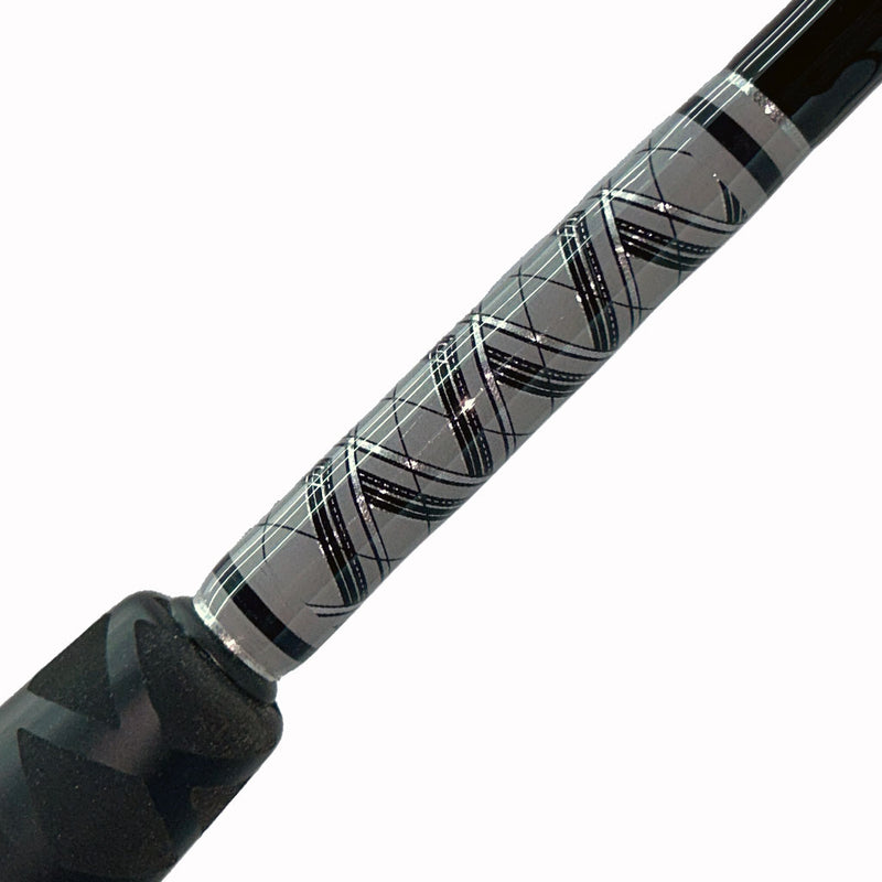 Load image into Gallery viewer, #79 Limited Edition 7&#39; 30-50lb Bottom Fishing Rod. Side view of the butt wrap. All gray, black and silver diamond strands. Partial foam grip showing with heat shrink.
