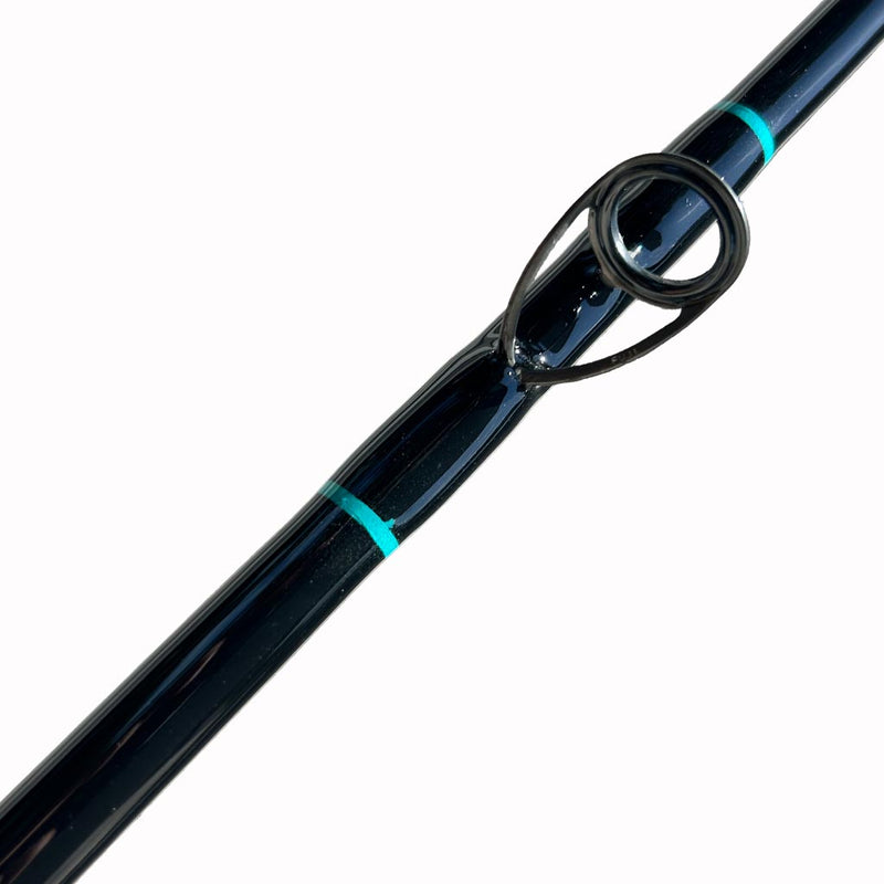 Load image into Gallery viewer, Built like our Fin #21, this spinning rod comes with Fuji alconite guides, EVA foam grips, Fuji reel seat, and metal gimble. Bottom eyelet shown from front facing angle. trims are teal. 
