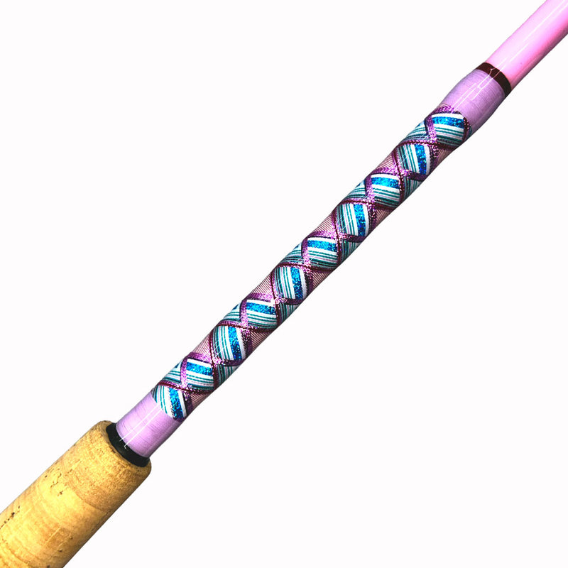 Load image into Gallery viewer, #80 Limited Edition 7&#39;0&quot; 10-17lb Heavy Inshore Rod. Partial cork grip shown. Butt wrap photo side view. Diamond pattern, Metallic pink, metallic magenta, metallic blue, metallic teal, white and red. Painted pink blank.

