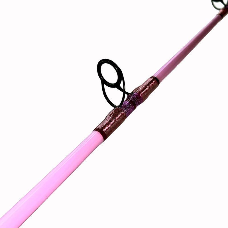 Load image into Gallery viewer, #80 Limited Edition 7&#39;0&quot; 10-17lb Heavy Inshore Rod. First double footed eyelet photo. Painted pink blank. Metallic pink, Metallic magenta and red trims. 
