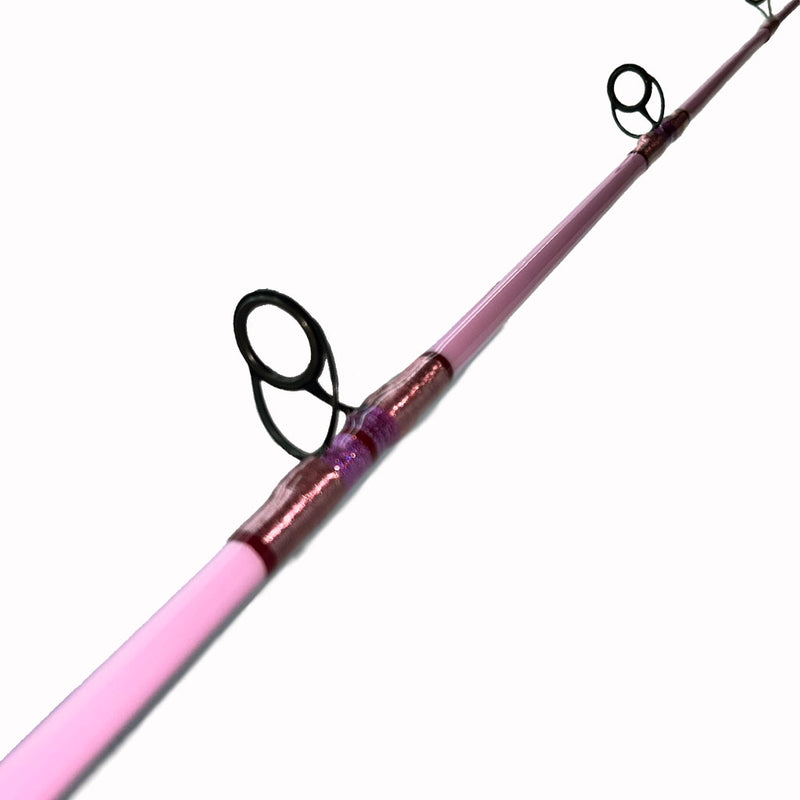 Load image into Gallery viewer, #80 Limited Edition 7&#39;0&quot; 10-17lb Heavy Inshore Rod. First two double footed eyelets shown. Painted pink blank. Metallic pink, metallic magenta and red trims. 
